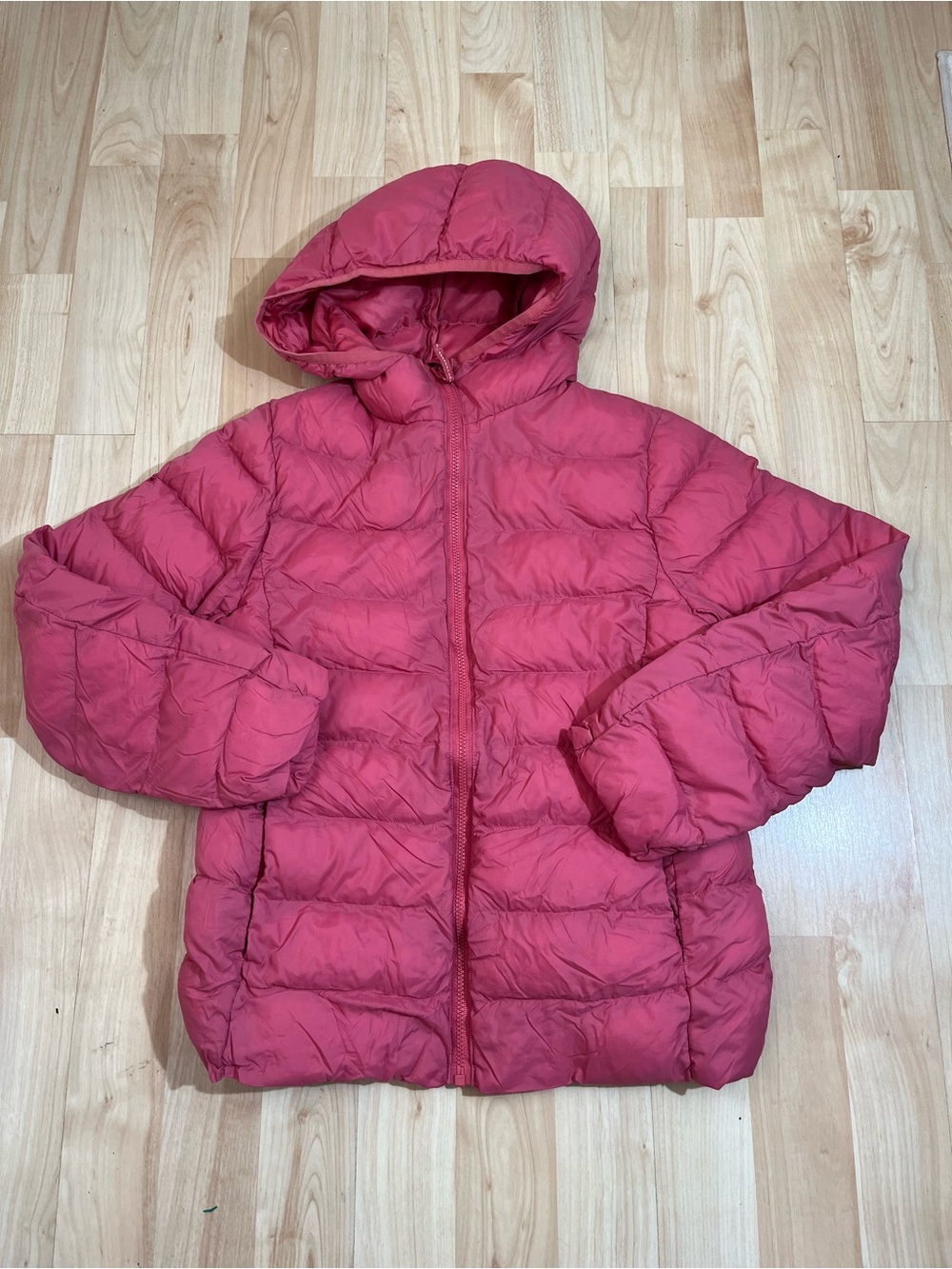 Uniqlo kids' hooded lightweight puffer jacket in a pink 9-10 years